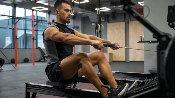 attractive-fit-man-working-out-gym